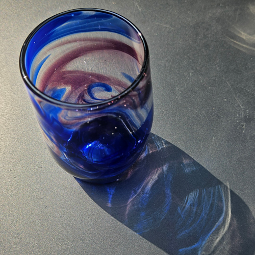 Glass with blue and purple swirls