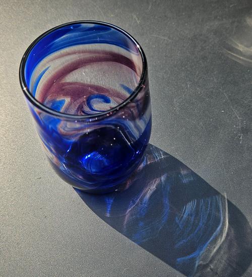 Glass with blue and purple swirls